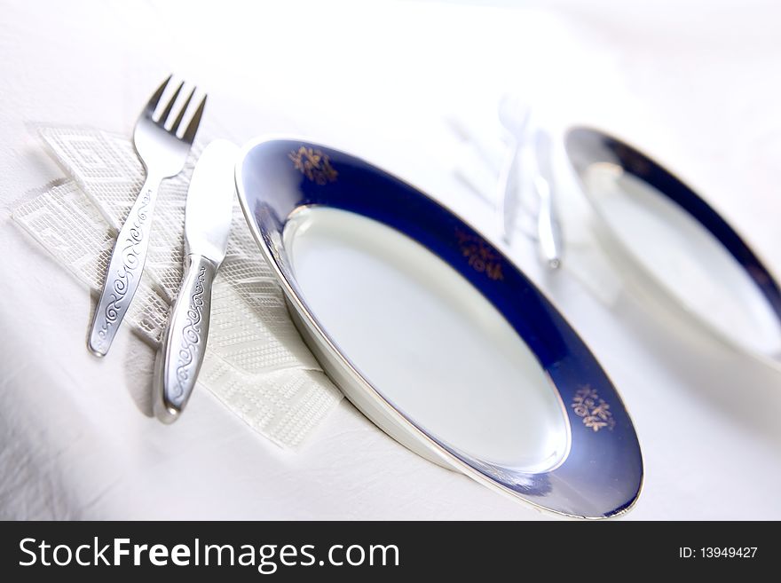 Plate and fork on table