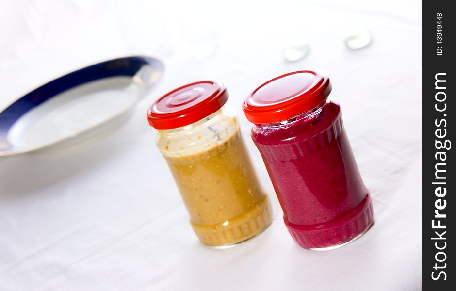 Two tasty color sauce in jars. Two tasty color sauce in jars