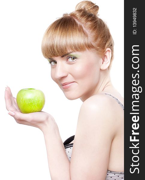 Beautiful smiling girl with green apple