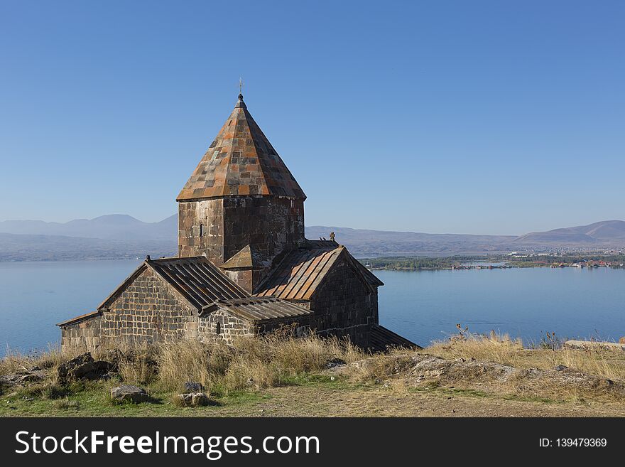 Scenic view of an old Sevanavank church in Sevan, Armenia on sunny day, blue sky