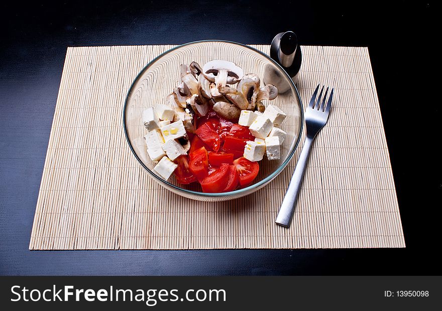 Italian salad with tomatoes, mushrooms and cheese