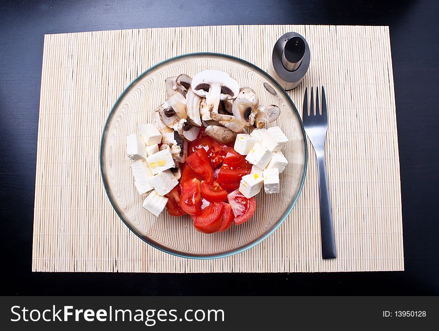 Italian salad with tomatoes, mushrooms and cheese