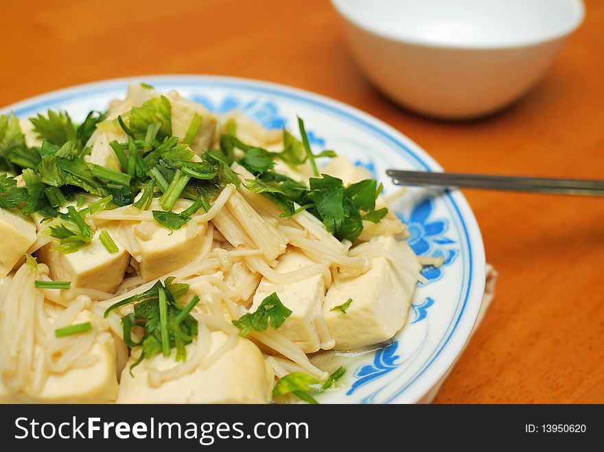 Chinese vegetarian bean curd cuisine. Ingredients include bean curd and mushrooms. Suitable for food and beverage, healthy eating and lifestyle, and diet and nutrition.