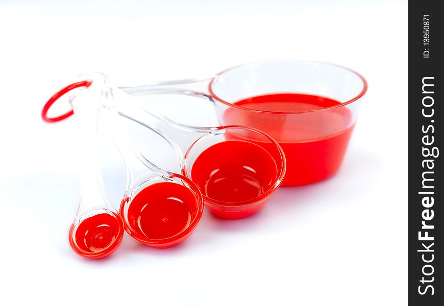 Measuring cups isolated against a blue background