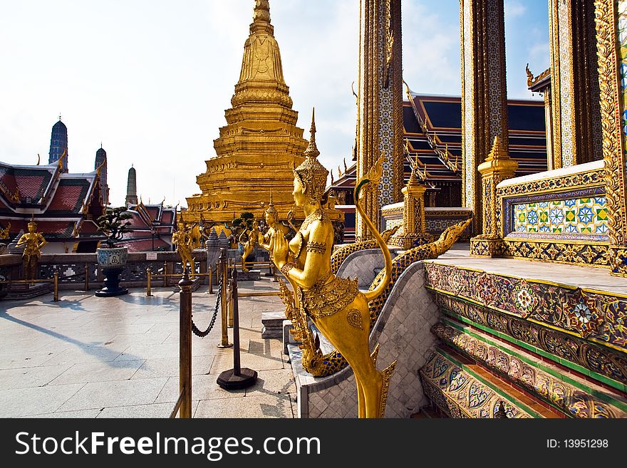 A kinaree, a mythology figure, is watching the temple in the Grand Palace. A kinaree, a mythology figure, is watching the temple in the Grand Palace