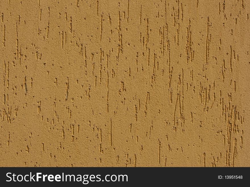 Fragment of a wall of yellow colour, abstract background