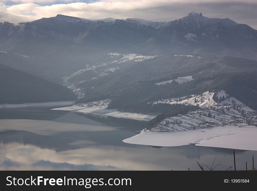 Ceahlau mountain and Bicaz lake (Romania) in a winter morning