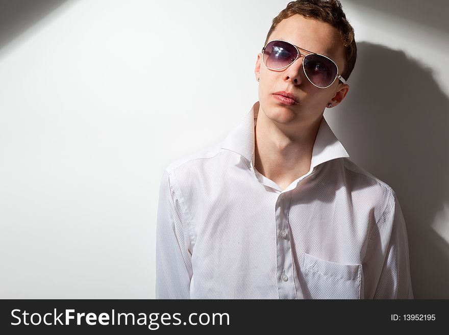 Portrait of young handsome man in sunglasses