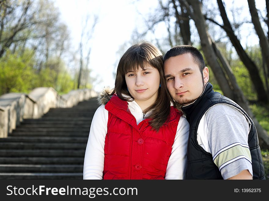 Teenager girl and boy posing and looking at camera. Teenager girl and boy posing and looking at camera