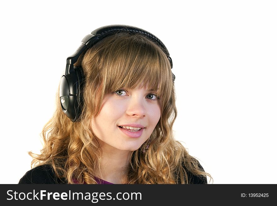 Beautiful young lady with headphones looking at camera. Beautiful young lady with headphones looking at camera