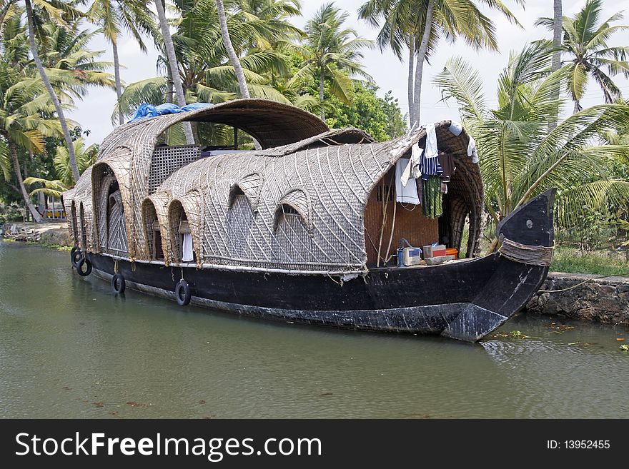 A converted rice barge ( kettuvallam ) on the backwates of Kerala, India