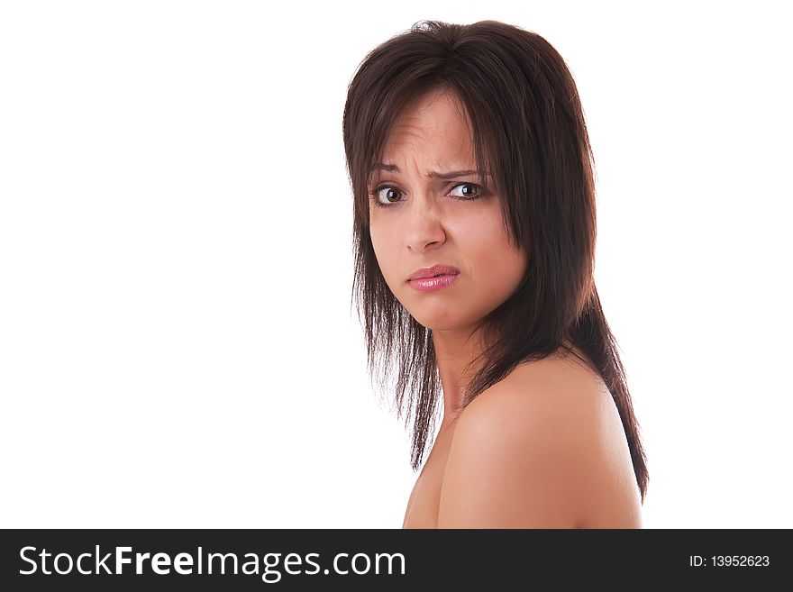 Close up portrait of a beautiful woman with sad emotion on her face, on a white background;