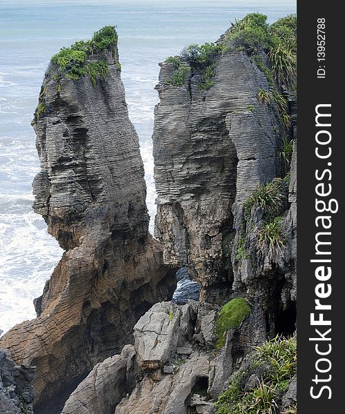 Weathered rock with ocean in background