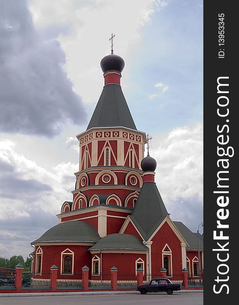 Red russian church at cloudy day