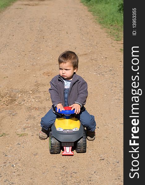 Child With His Toy Car