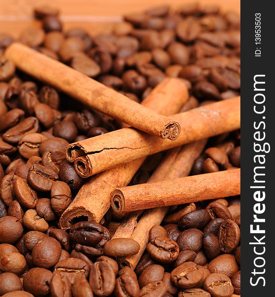 Background of coffee beans andcinnamon sticks. Background of coffee beans andcinnamon sticks