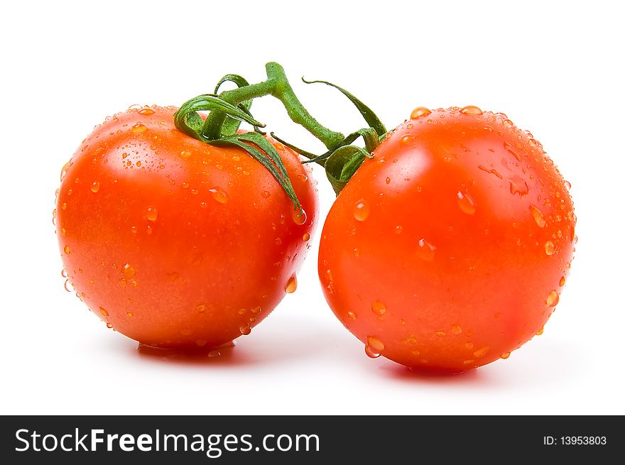 Two ripe tomatoes on a white background.