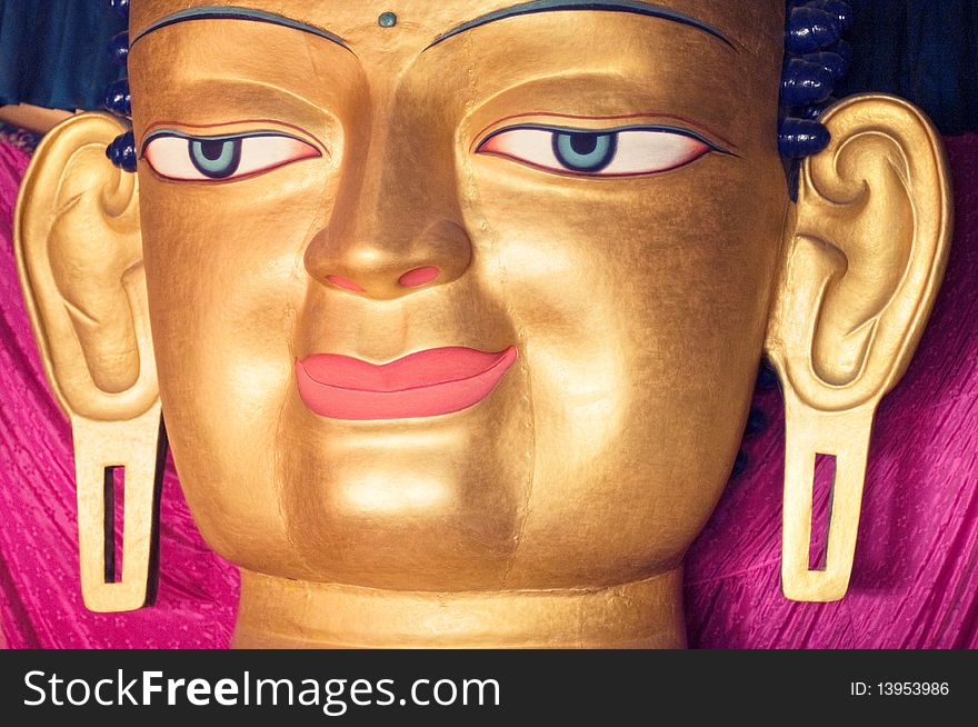 A close up shot of Buddha's face. A close up shot of Buddha's face.