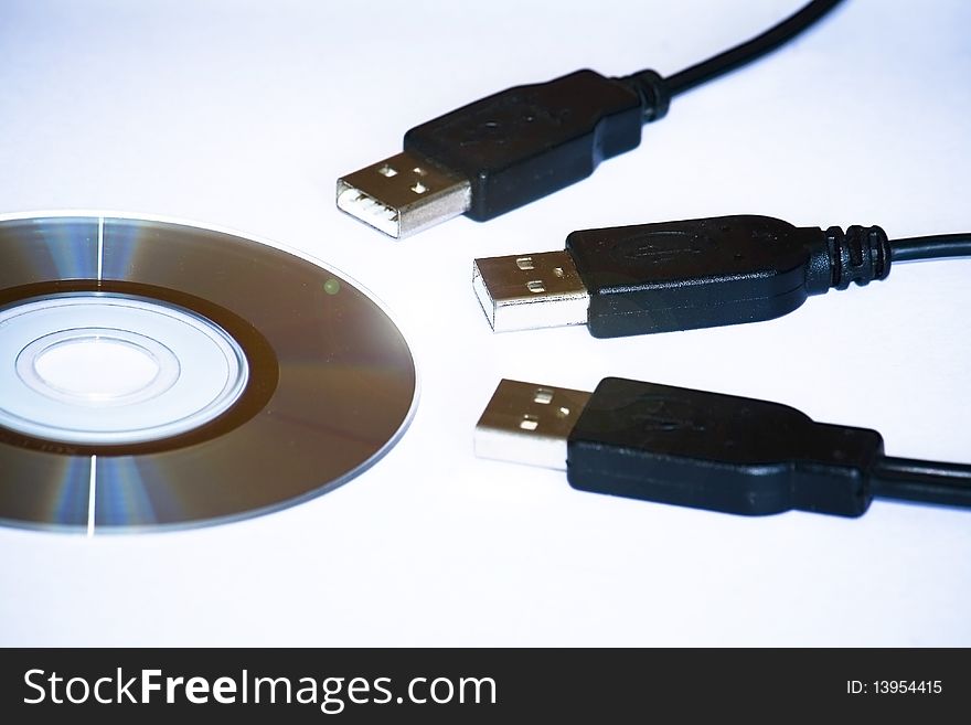 Three USB plugs are transfering files from DVD. Three USB plugs are transfering files from DVD