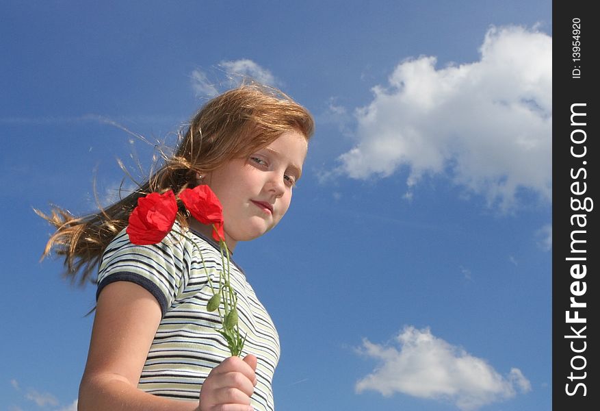 Girl with poppies over sky