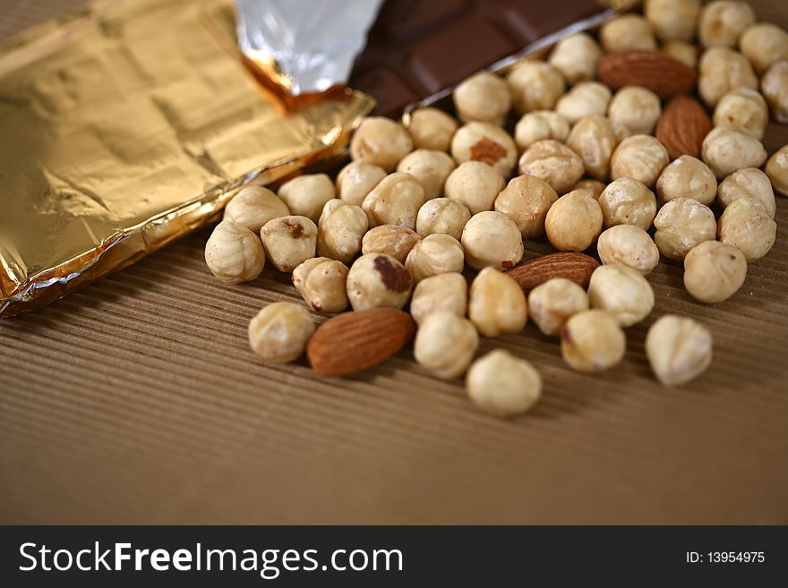 Enjoy chocolate with almonds and hazelnut blended image. Enjoy chocolate with almonds and hazelnut blended image