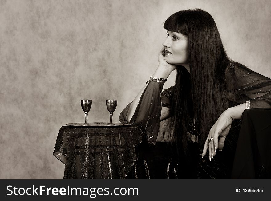 Beautiful woman with silver   wineglass