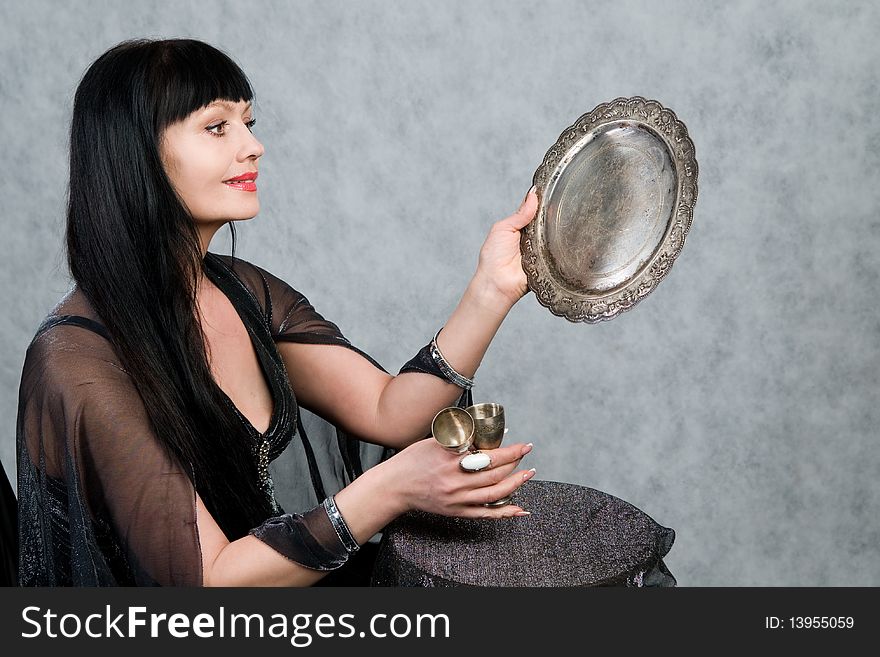 Beautiful woman of forty-five years and silver wineglass. Beautiful woman of forty-five years and silver wineglass