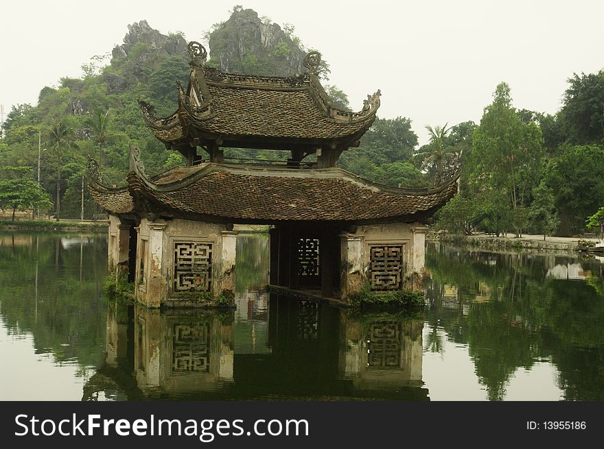 Small pagoda in the middle of its water. All this pagoda in Vietnam have opened a pool. Element Pagoda in the middle of the water. Small pagoda in the middle of its water. All this pagoda in Vietnam have opened a pool. Element Pagoda in the middle of the water