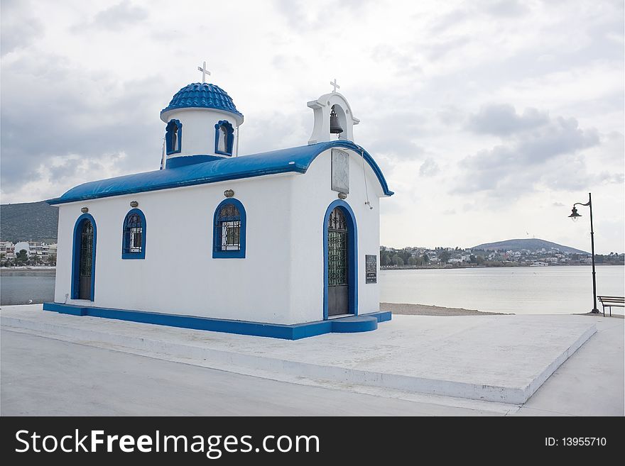 A typical Greek white and blue chapel in N. Artaki, Evia region. A typical Greek white and blue chapel in N. Artaki, Evia region