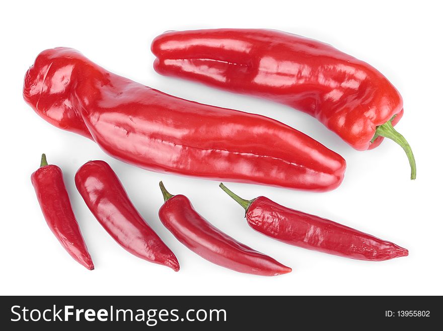 Sweet red peppers and chillies selection over white. Sweet red peppers and chillies selection over white