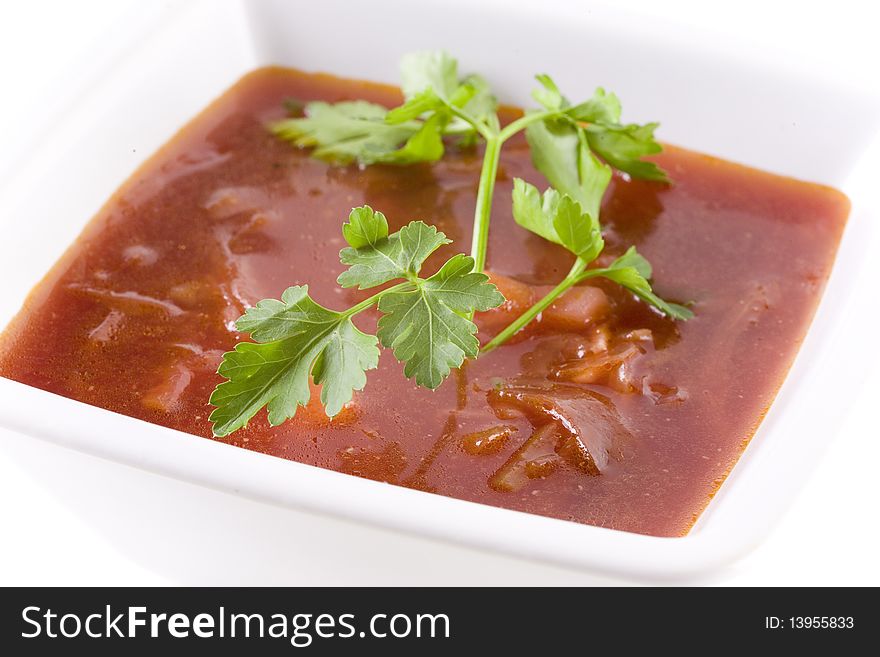 Borscht in white bowl isolated on white. Borscht in white bowl isolated on white