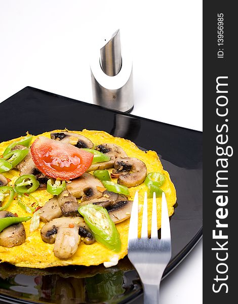 Traditional omlette made with mushrooms and green pepper