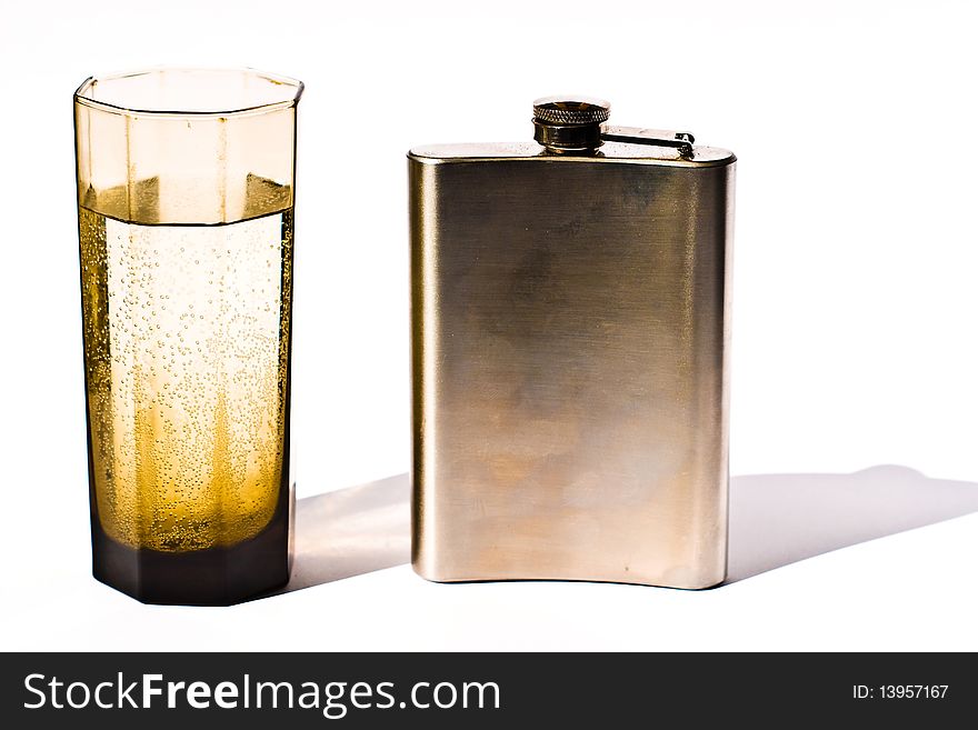 Glass vessels standing on the white table, isolated background