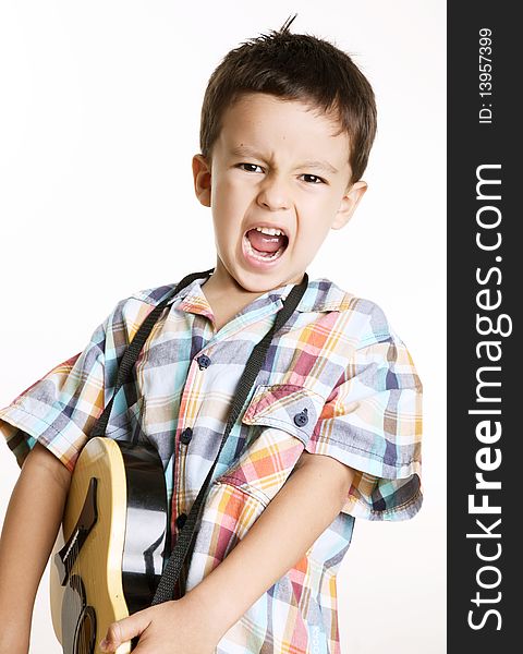 Happy kid playing guitar over white background