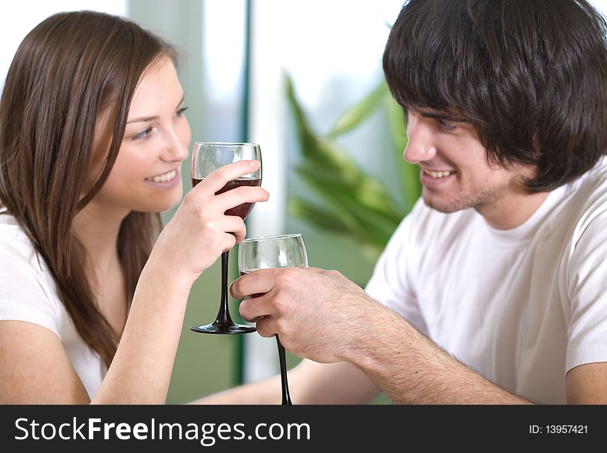 Boy with smile and beautiful girl with wineglasses. Boy with smile and beautiful girl with wineglasses