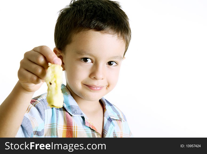 Child looking at the camera and smiling after eating an apple. Child looking at the camera and smiling after eating an apple