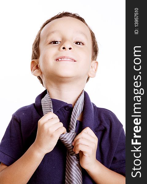 Child playing with a tie as a businessman. Child playing with a tie as a businessman