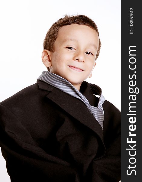 Boy dressed in suit tie over white background. Boy dressed in suit tie over white background