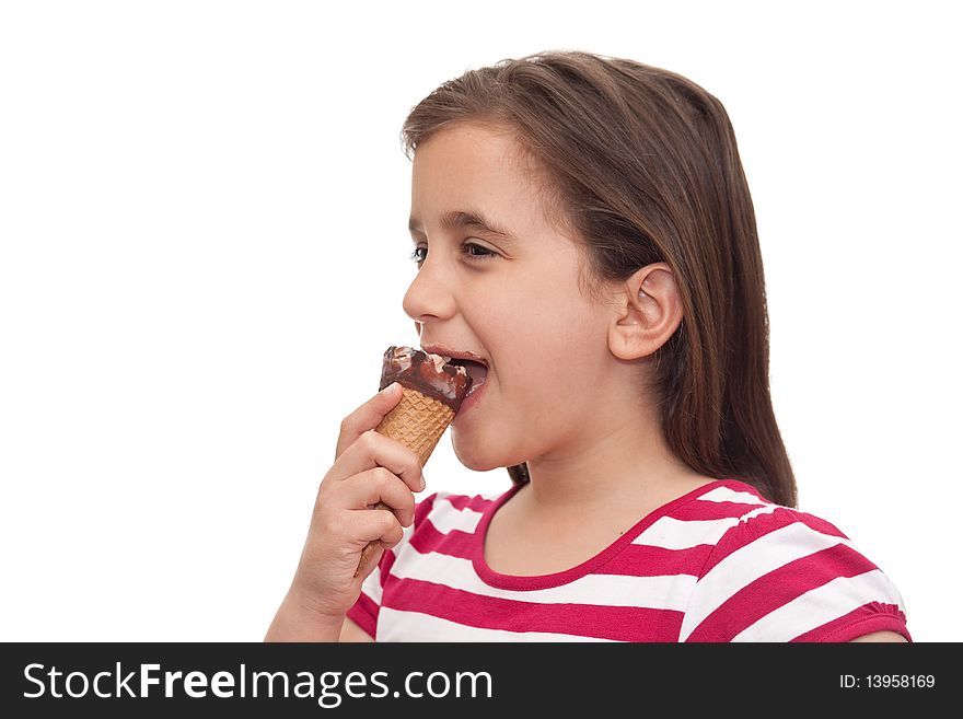 Small girl eating an ice cream cone on a white background