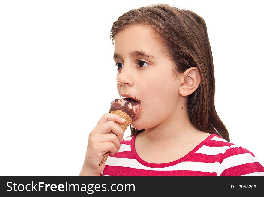 Small girl licking an ice cream cone on a white background