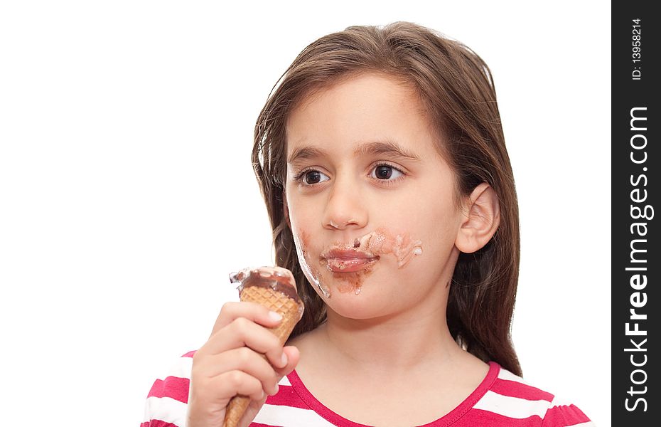 Small girl eating an ice cream cone on a white background