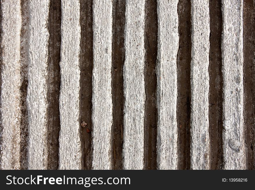 Closeup detail of vertical pattern of corrugated, grooved concrete. Closeup detail of vertical pattern of corrugated, grooved concrete