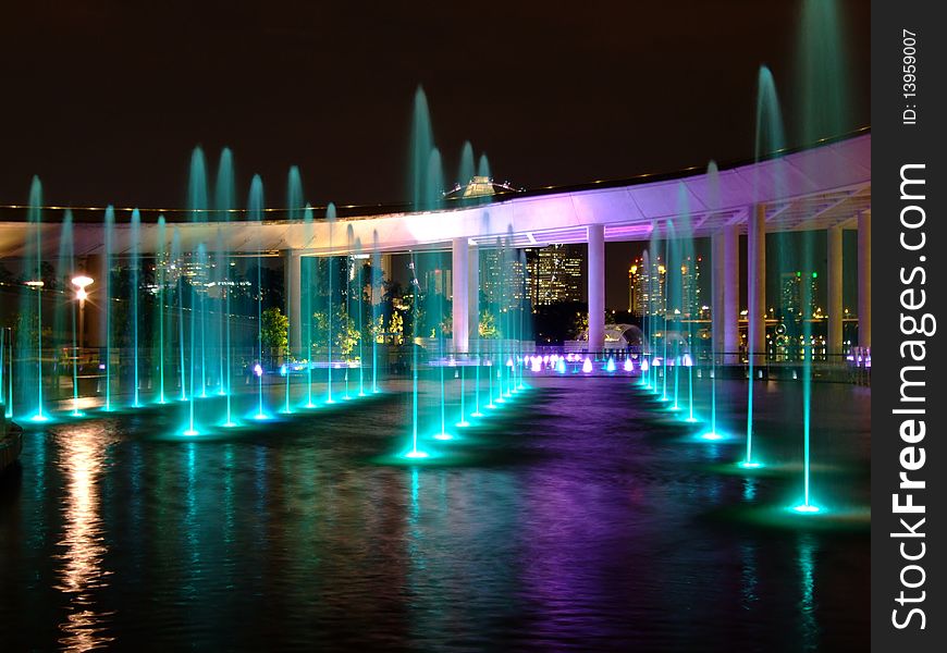 Colourful lighted water fountain at Marina Barrage