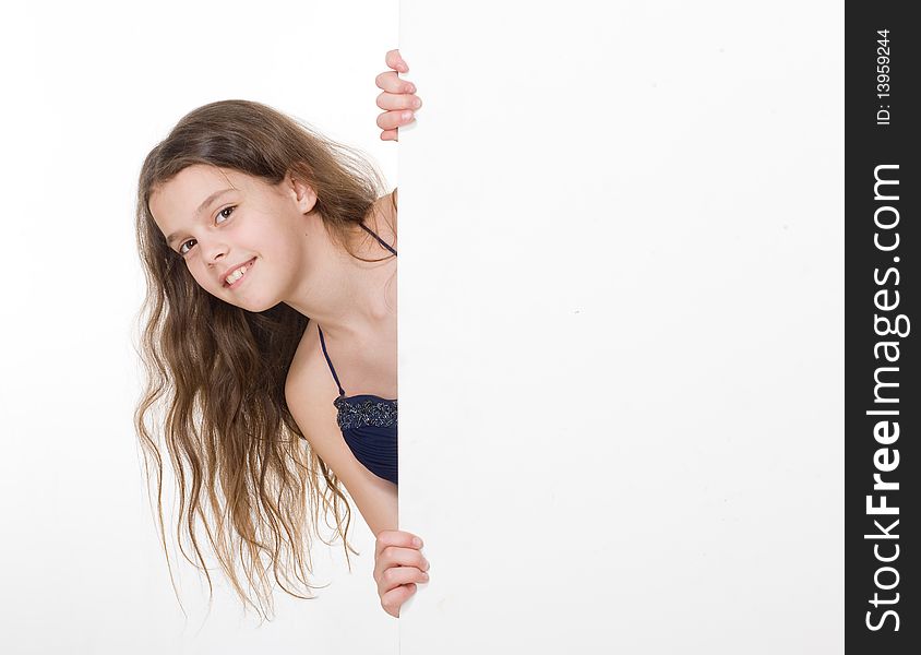 Young girl with sheet of paper on white background