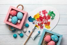 Easter Background With Colorful Eggs, Paints, Brushes On Stone Gray. Top View With Copy Space Stock Photo