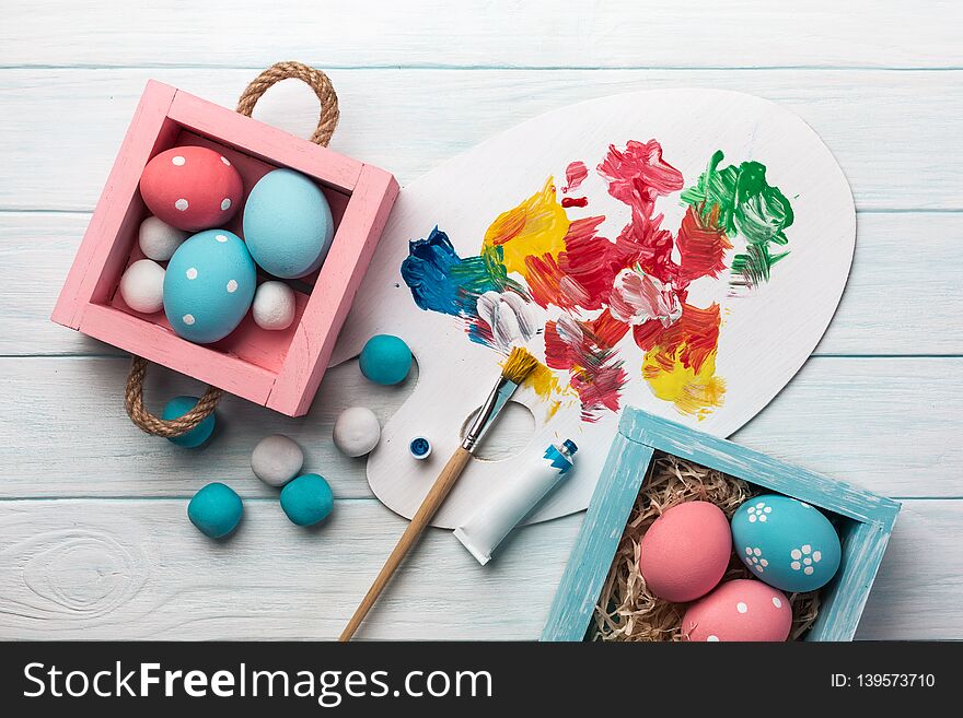 Easter Background With Colorful Eggs, Paints, Brushes On Stone Gray. Top View With Copy Space