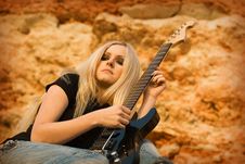 The Beautiful Blonde With A Guitar Stock Photo