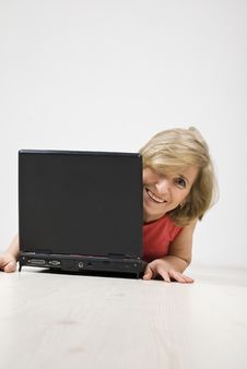 Senior Woman Laughing Behind A Laptop Royalty Free Stock Images Senior Woman Laughing Behind A Laptop Royalty Free Stock Images