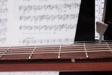 Closeup Guitar Neck, Notes And Metronome Royalty Free Stock Photos Closeup Guitar Neck, Notes And Metronome Royalty Free Stock Photos