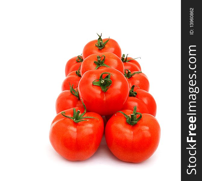 A few red tomatoes isolated on white. A few red tomatoes isolated on white